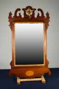 CHIPPENDALE STYLE INLAID MAHOGANY AND PARCEL GILT WALL MIRROR, the bevel edges plate within a
