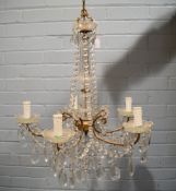 EARLY TWENTIETH CENTURY GILT METAL AND CUT GLASS FIVE BRANCH ELECTROLIER, with prism cut drops and