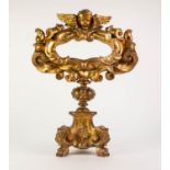 NINETEENTH CENTURY CARVED GILT WOOD PEDESTAL RELIQUARY, the oval aperture with scroll work frame and