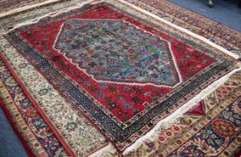 PERSIAN WOOL RUG, with octagonal large centre  panel with all-over scattered design of stylized