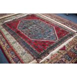 PERSIAN WOOL RUG, with octagonal large centre  panel with all-over scattered design of stylized