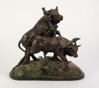AFTER G. STAEHLI, GREEN BRONZED COMPOSITION TABLE LAMP GROUP, modelled as a pair of oxen, one