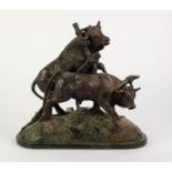 AFTER G. STAEHLI, GREEN BRONZED COMPOSITION TABLE LAMP GROUP, modelled as a pair of oxen, one