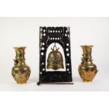 PAIR OF EARLY TWENTIETH CENTURY CHINESE EMBOSSED BRASS VASES, each of ovoid, footed form with a