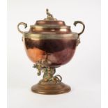 REGENCY COPPER AND BRASS TWO HANDLED PEDESTAL TEA URN, of oval form with sphinx finial, open