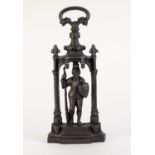 TALL CAST IRON DOOR STOP, modelled as a knight standing beneath a gothic archway, with top