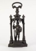 TALL CAST IRON DOOR STOP, modelled as a knight standing beneath a gothic archway, with top