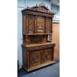 LATE NINETEENTH/ EARLY TWENTIETH CENTURY CONTINENTAL CARVED WALNUT HUNTER?S CABINET, the moulded