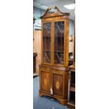 SHERATON STYLE INLAID AND FIGURED MAHOGANY FLOOR STANDING DOUBLE CORNER CUPBOARD, the upper