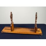 VICTORIAN CARVED OAK ?GOTHIC? ADJUSTABLE BOOKRACK, the sliding ends each of fleur de lys form, set