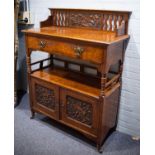ARTS AND CRAFTS CARVED OAK AND POLLARD OAK TWO TIER BUFFET, the top with floral carved panel to