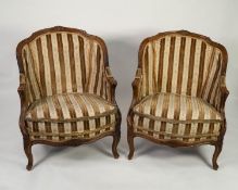 PAIR OF LATE NINETEENTH CENTURY FRENCH WALNUT BERGERE CHAIRS, each with moulded show wood frame with