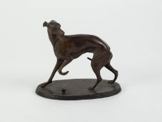 P.T. MENE PATINATED BRONZE MODEL OF A GREYHOUND, modelled standing with front left paw raised and