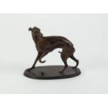 P.T. MENE PATINATED BRONZE MODEL OF A GREYHOUND, modelled standing with front left paw raised and