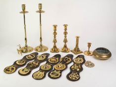 PAIR OF ANTIQUE BRASS EJECTOR CANDLESTICKS, with square bases, 9 ½? (24.1c) high, together with a