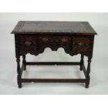 NINETEENTH CENTURY CARVED OAK WRITING OR DRESSING TABLE IN THE EIGHTEENTH CENTURY STYLE, the moulded