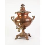 EARLY TWENTIETH CENTURY EMBOSSED COPPER PEDESTAL TEA URN, with foliate finial, white pot handles and