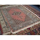 LIBRA CARPETS, CALCUTTA, MACHINE WOVEN RUG  with diamond shaped centre medallion and spandrels in