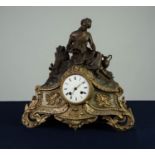 FRENCH LATE NINETEENTH CENTURY AND PARCEL GILT METAL CLOCK with 8 day  movement striking on  a domed