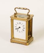 A BRASS CARRIAGE CLOCK (CASE WITH TWO GLASS PANELS MISSING)