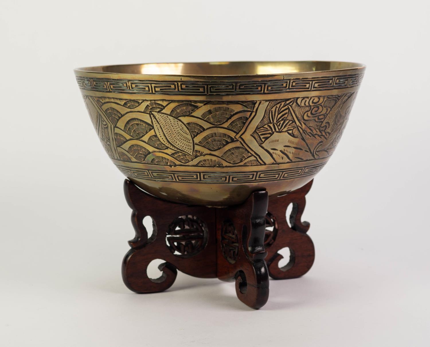EARLY TWENTIETH CENTURY CHINESE ENGRAVED BRASS BOWL ON PIERCED HARDWOOD STAND, the bowl of steep - Image 3 of 4