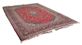 KASHAN PERSIAN CARPET, with lozenge shaped centre dark blue and floral medallions with pendants