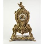 CAST BRASS LARGE MANTLE CLOCK IN THE ROCOCO TASTE, the twelve piece 4? Roman dial powered by a