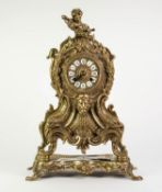 CAST BRASS LARGE MANTLE CLOCK IN THE ROCOCO TASTE, the twelve piece 4? Roman dial powered by a