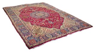 TABRIZ PERSIAN CARPET, with blue and floral shaped circular centre medallion with pendants on a