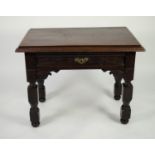 ANTIQUE AND LATER CARVED OAK WRITING TABLE, the heavy oblong top with moulded edge, set above a