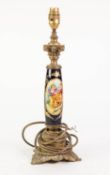 EARLY TWENTIETH CENTURY GILT METAL MOUNTED PORCELAIN TABLE LAMP BASE, with hand painted oval panel