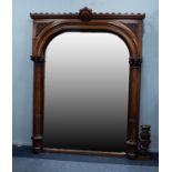 IMPRESSIVE EARLY NINETEENTH CENTURY CRAVED MAHOGANY WALL MIRROR, the arched plate housed in a flat