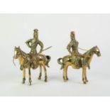PAIR OF ORIENTAL BRASS FIGURES OF EQUESTRIAN WARRIORS, each modelled holding a weapon, removable,