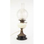 EARLY TWENTIETH CENTURY GILT METAL OIL TABLE LAMP, with gilt lined white glass reservoir, acid