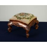 VICTORIAN CARVED WALNUT SQUARE FOOTSTOOL, with cream and floral wool work tapestry cover, moulded