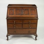 SIMPOLES OF MANCHESTER, GOOD QUALITY OAK BUREAU, of typical form with low back above a four panelled