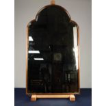 MAHOGANY FRAMED BEVEL EDGED WALL MIRROR, the arch topped plate within a slender, moulded frame,