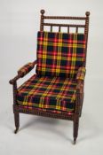 WILLIAM IV BOBBIN TURNED AND STAINED BEECH LIBRARY CHAIR, with elbow pads and loose cushions to