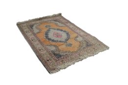 EASTERN RUG, with lozenge shaped centre medallion with pendants on plain salmon pink field