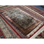 EASTERN PART SILK FINELY KNOTTED RUG, with centre lozenge shaped medallion with pendants on a
