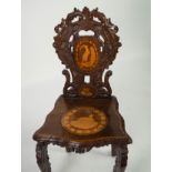 LATE NINETEENTH/ EARLY TWENTIETH CENTURY CONTINENTAL INLAID AND CARVED WALNUT HALL CHAIR, the