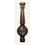 MODERN OC ANCHOR, FEATHER VENEERED MAHOGANY ANEROID BANJO BAROMETER, with 6 ¼? dial, mercury