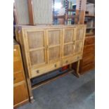 ARTS AND CRAFTS STYLE OAK CABINET, ENCLOSED BY TWO PAIRS OF FRAMED PANEL DOORS, WITH ROW OF TWO