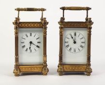 EARLY TWENTIETH CENTURY PAIR OF GILT BRASS CARRIAGE CLOCKS, each with white enamelled Roman dial,