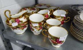 A ROYAL CHELSEA 'GOLDEN ROSE' PATTERN TEA SERVICE OF 39 PIECES