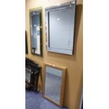 TWO OBLONG FRAMELESS WALL MIRRORS AND A GILT FRAMED WALL MIRROR (3)