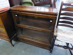 A GLOBE WERNICKE TYPE OAK TWO-TIER SECTIONAL BOOKCASE