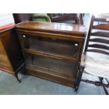 A GLOBE WERNICKE TYPE OAK TWO-TIER SECTIONAL BOOKCASE