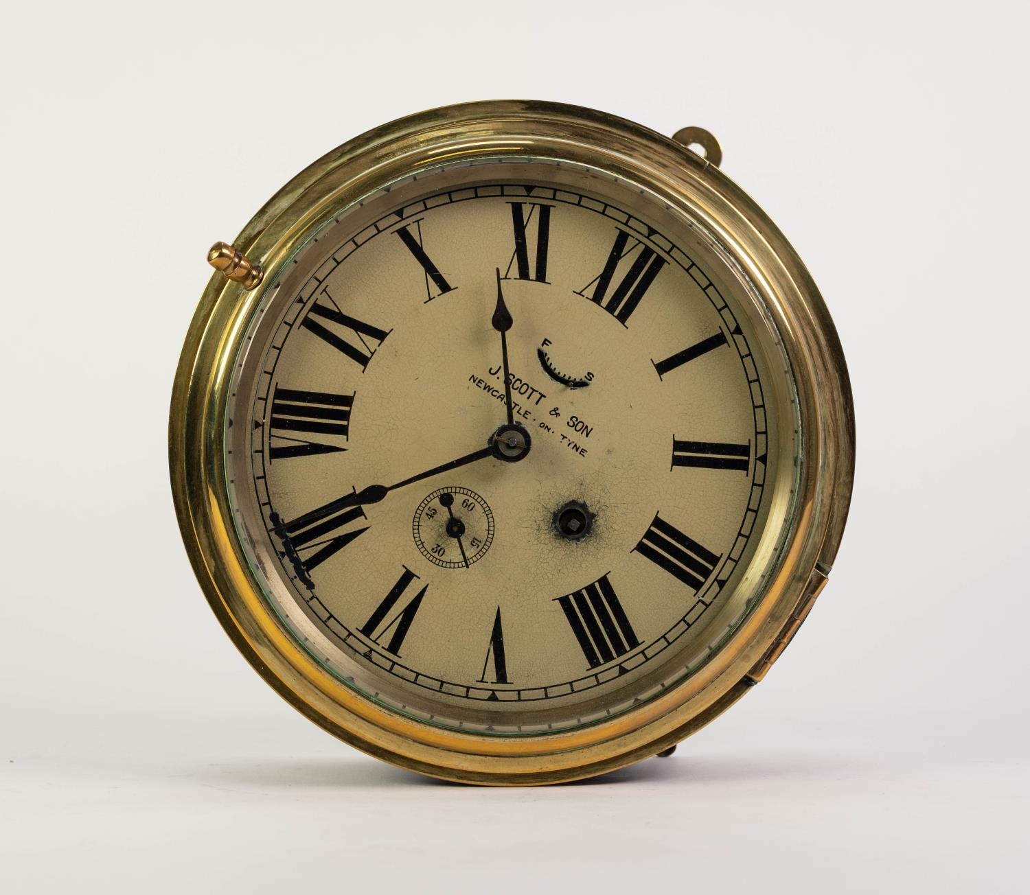 J. SCOTT & SON, NEWCASTLE UPON TYNE BRASS FRONTED SHIP?S PORT HOLE WALL CLOCK, of typical form