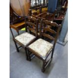 A SET OF SIX ELM LADDER BACK DINING CHAIRS WITH DROP-IN SEATS, COMPRISING A PAIR OF CARVERS